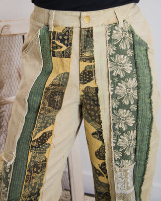 Boho vintage patchwork jeans with sage green floral and bandana panels, frayed edges, women’s bottoms at Makenzie Layne Boutique