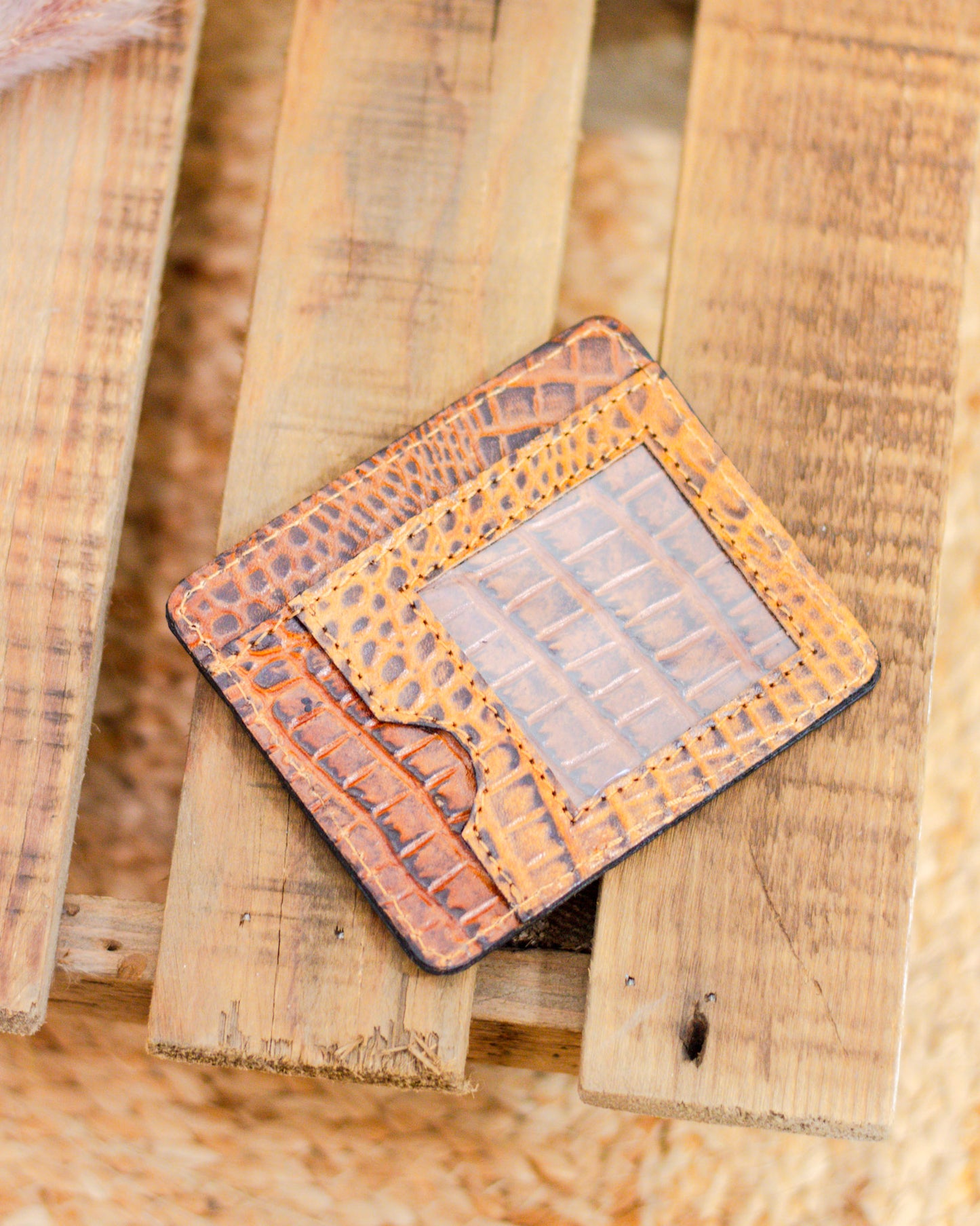 Genuine leather crocodile embossed ID card holder with clear window and pocket slot, perfect for keeping your essentials secure in a slim, rustic style.