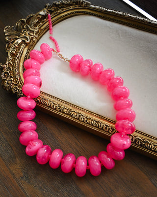 Hot pink chunky bead necklace with glossy marbled acrylic beads, bold statement jewelry for women, colorful boutique accessory perfect for summer outfits and vacation style.