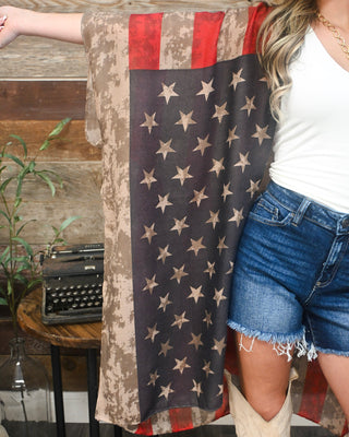 Women’s oversized American flag kimono with vintage-inspired stars and stripes, lightweight flowy fit, and western boutique style perfect for summer and concerts.