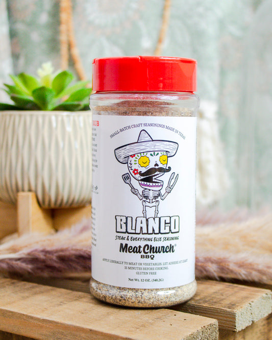 Meat Church Blanco seasoning rub, 12 oz bottle with white label and festive skeleton design—versatile steak & veggie blend at Makenzie Layne Boutique