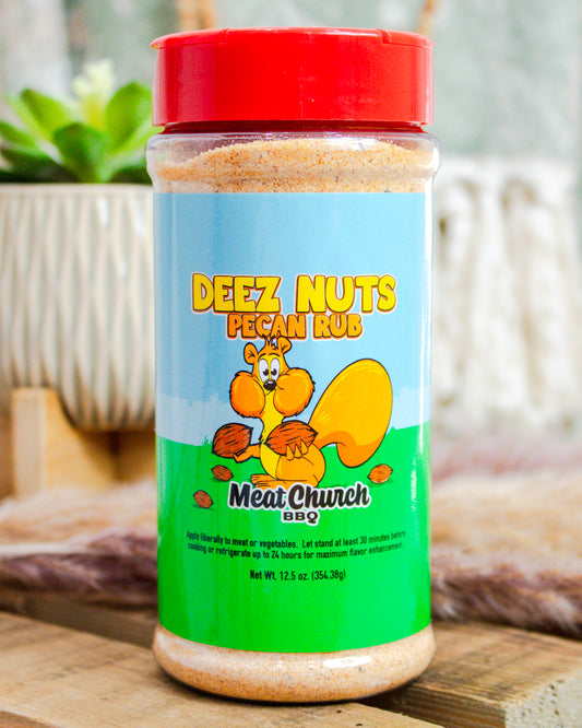 Meat Church Deez Nuts Pecan Rub seasoning bottle, 12.5 oz, featuring cartoon squirrel on bright label—sweet & savory BBQ rub at Makenzie Layne Boutique