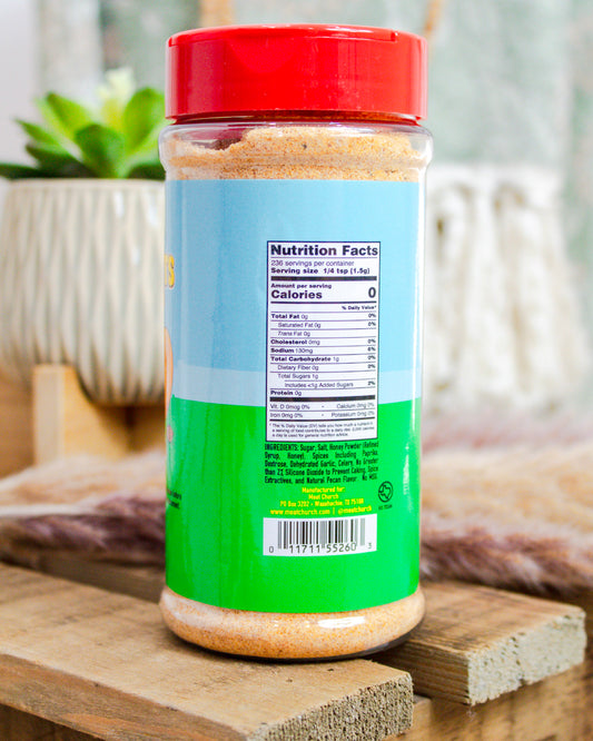 Jar with a red lid and green label on a wooden surface