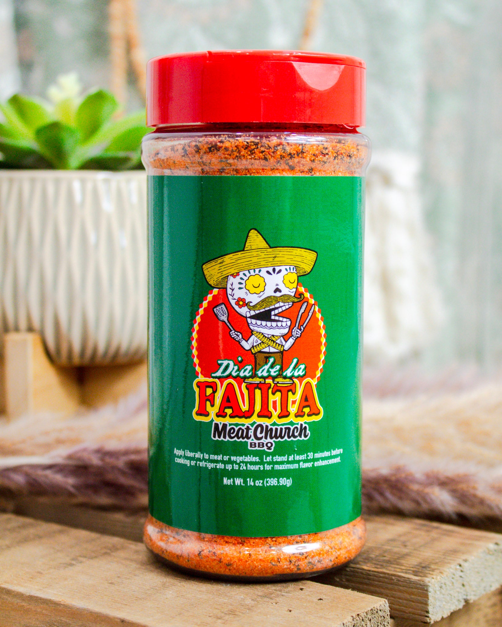 Meat Church Dia de la Fajita BBQ rub, 14 oz bottle with green label and festive skeleton graphic—bold Tex-Mex seasoning at Makenzie Layne Boutique