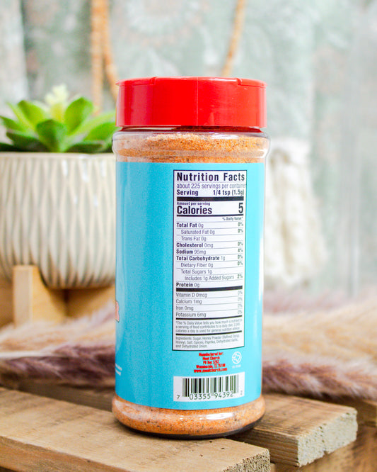 Back label of Meat Church Deez Nuts Pecan Rub showing nutrition facts and ingredients on bright blue packaging—sweet BBQ seasoning at Makenzie Layne Boutique