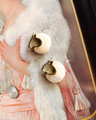 Ivory marbled statement hoop earrings with gold-tone accents, featuring a bold rounded design for an elevated women’s boutique jewelry look.