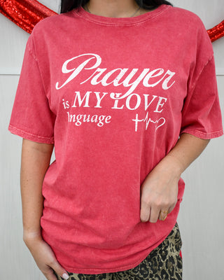 Red t-shirt with 'Prayer is MY LOVE language' text worn by a person.