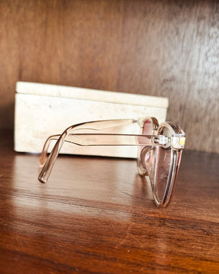 Transparent blush pink cat-eye sunglasses with oversized frames and tonal lenses, a chic women’s boutique accessory for everyday style.