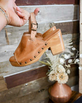 Tan leather slingback clog sandals with wooden block heel, studded details, and adjustable buckle strap. Trendy boutique clogs perfect for boho, western, and everyday outfits.