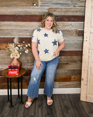 women’s beige star graphic t-shirt with distressed denim star patches, patriotic boutique top styled with cropped jeans, casual Memorial Day summer outfit