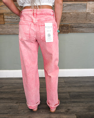 Women’s pink mineral wash straight leg jeans with cuffed hem and back pockets, styled with a cropped blouse for a fun boho boutique look